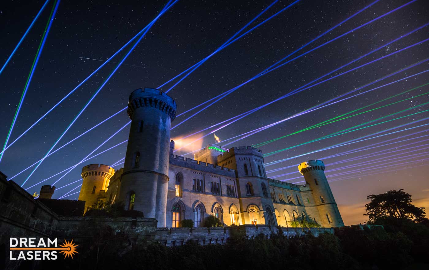 Blue and green laser beams above Eastnor Castle